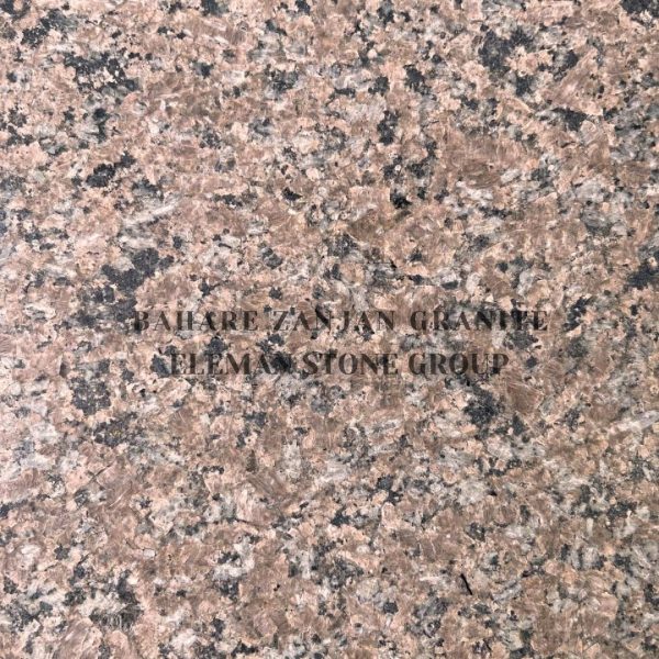 سنگ گرانیت بهاره زنجان با زمینه صورتی و گلبهی رنگ و رگه‌های سبز و تیره